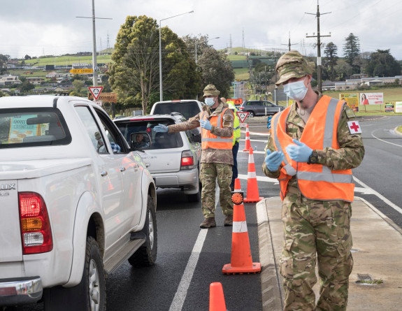 Two soldiers wearing high vis and masks at a checkpoint in Auckland 