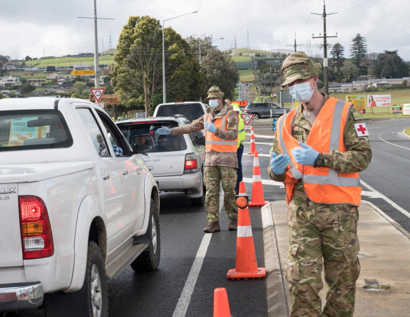 Two soldiers wearing high vis and masks at a checkpoint in Auckland