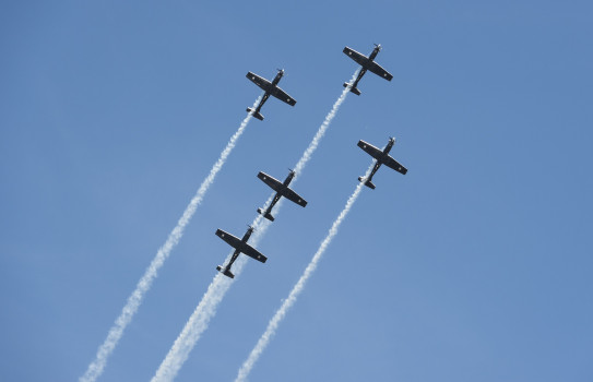 Five ship Texan aircraft flying in formation.
