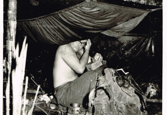 A signaller hard at work during his deployment in Malaya