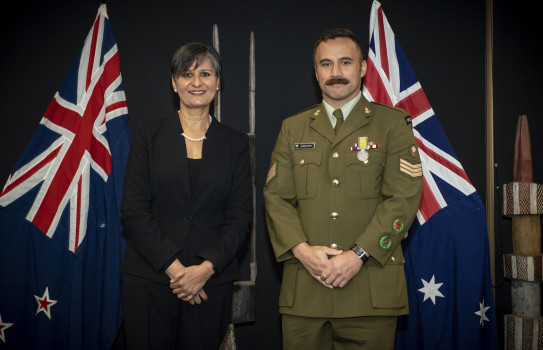 Australian High Commissioner, Her Excellency, Harinder Sidhu, presents Sergeant Nahi the Australian National Emergency Medal