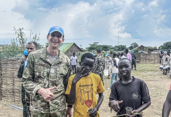Soldier standing with kids