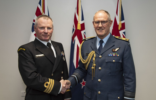 Chief of Defence Force, Air Marshal Kevin Short, presents a Defence Meritorious Service Medal to Commander Glenn Avard 