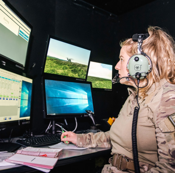 A member of the Royal New Zealand Air Force's No. 3 Squadron in the NH90 simulator control area. 