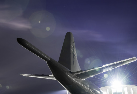 P-3K Orion in the night light, showing the tail of the aircraft.