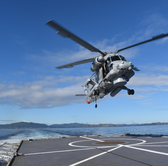 Te Mana’s embarked Seasprite helicopter touches down on the flight deck following a Force Protection serial.