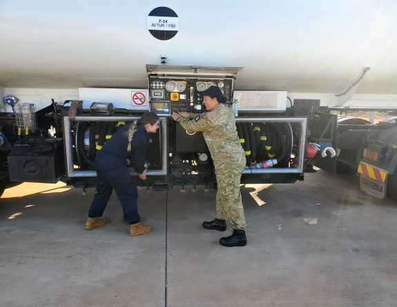 RAAF Leading Aircraft Woman Emma Nearmy, left, and RNZAF Leading Aircraftman Katrina James working with one of the RAAF’s mobile refuelling vehicle