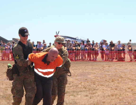 RNZAF and RAAF personnel give a security demonstration during the public open day at RAAF Base Darwin during Exercise Pitch Black