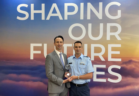 Flight Lieutenant Andrew Day, right, and his brother Matt Day with the Civil Aviation Navigation Services Organisation (CANSO) Global Safety Achievement Award