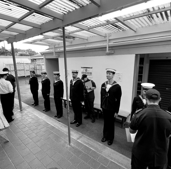 Recruits are lined up and uniform is checked during a muster on the Basic Common Training course.