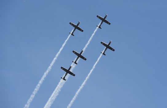 The Black Falcons take to the air during a 2022 display - five aircraft are in formation.