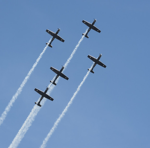 The Black Falcons take to the air during a 2022 display - five aircraft are in formation.