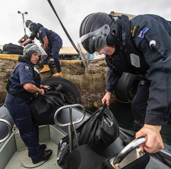 Fishery Officers from Fiji and New Zealand’s Ministry for Primary Industries prepare to embark HMNZS Wellington