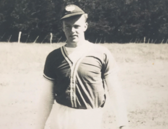 A young John Black in his softball uniform during his military days