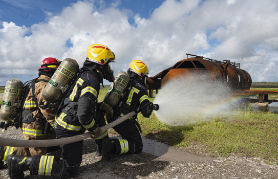 RNZAF and USAF firefighters work together during a joint live-fire training exercise during Mobility Guardian 23 at Andersen Air Force Base (Staff Sergeant Malissa Lott, USAF)   