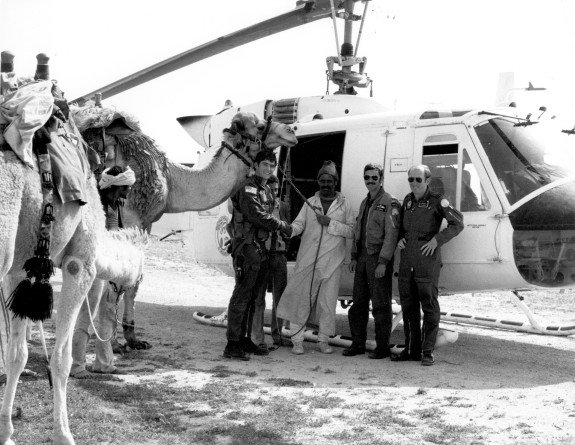 Personnel in front of helicopter