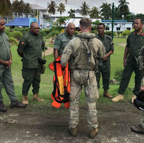 Major General Jone Kalouniwai Commander of the Republic of Fiji Military Forces, second from right, is transported from Suva to visit RFMF forces from 3rd Fijian Infantry Regiment in Kadavu