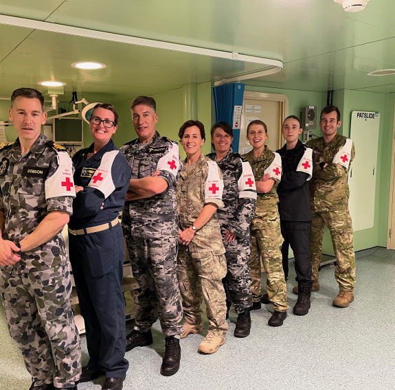 Major Louise Speedy, fourth from left, in the Intensive Care Unit On board Australian ship HMAS Canberra, with members of the ship's medical company, for Exercise RIMPAC