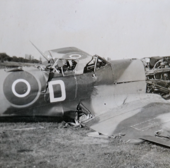 Black and white photo of a crashed Spitfire.