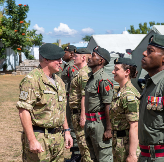 Major General John Boswell receiving a tour of Delta Company in Nadi