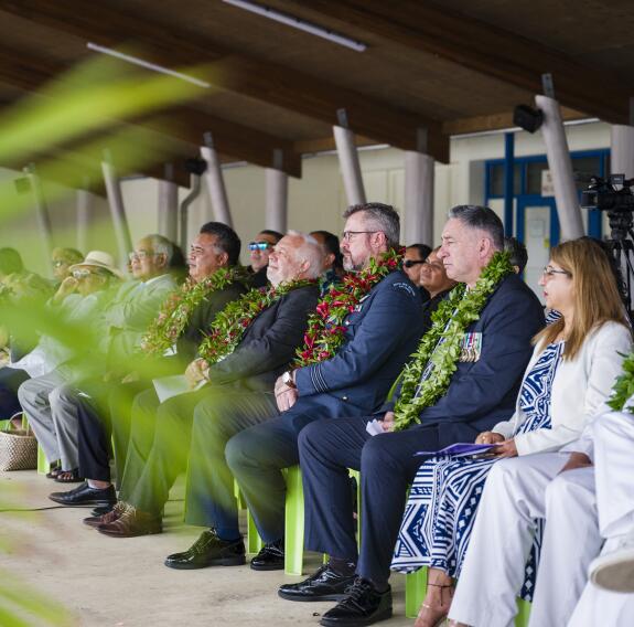 Guests sit watching the ceremony. 