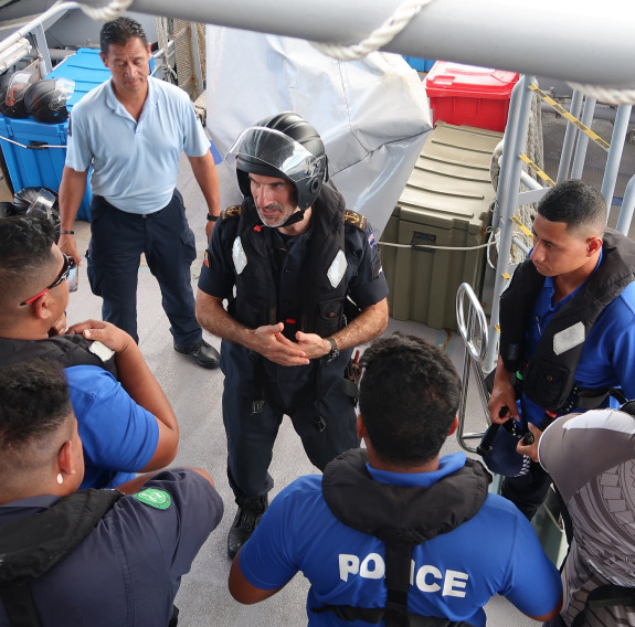  Leading Hydrographic Survey Technician Ivan Charchaflie briefs the boarding party