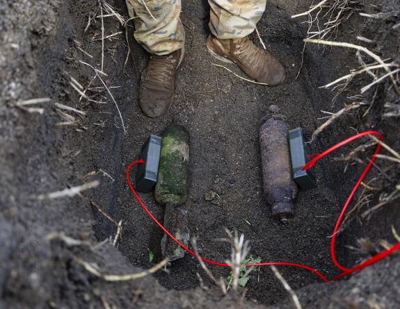 Explosive charges are placed on the Second World War ordnance for safe disposal
