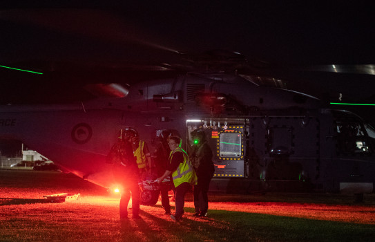 Two Royal New Zealand Air Force NH90 helicopters at Trentham Army Camp, transfering patients to Wellington Free Ambulance during the White Island recovery