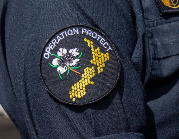 The Operation Protect patch, worn on a uniform