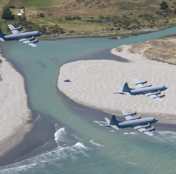 P-3K2 Orion aircraft taking part in a three-ship formation flight over the North Island, before the fleet retires at the end of the month.
