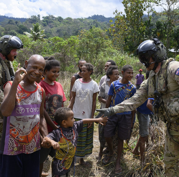RNZAF aviators interact with a small community of people in Papua New Guinea.
