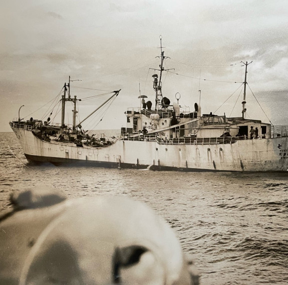 A sepia historic photo of a Japanese fishing vessel.
