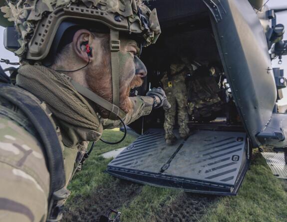 Soldiers prepare to board an NH90 helicopter to deploy to the Hokonui Hills area of operations