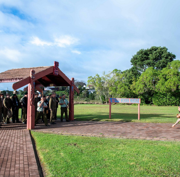 A pōwhiri welcomes attendees on to the marae.