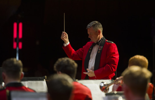 Director of Music Major Graham Hickman leads the New Zealand Army Band on stage at the Christchurch Town Hall