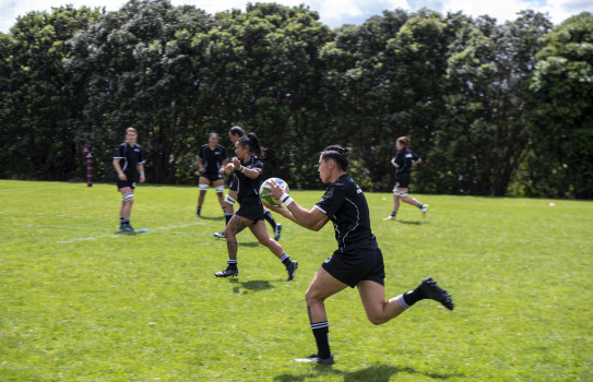 The Defence Ferns about to pass the ball during practice on the field.