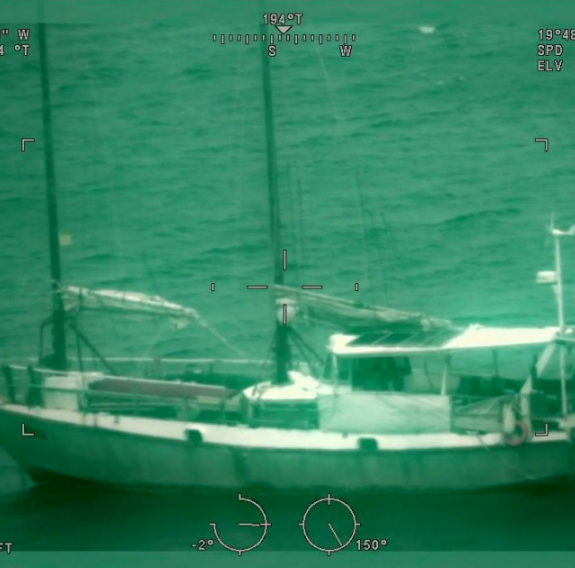 Green toned technical photo of a vessel at sea.