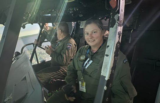 Teacher Tamsin Clark gets a chance in a RNZAF helicopter simulator.