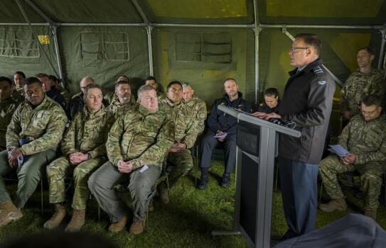  Warrant Officer One Brent Pene blows the conch to begin the pōwhiri