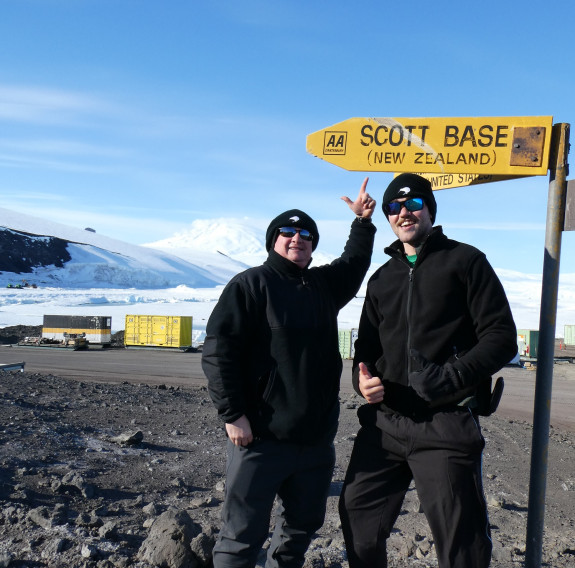 New Zealand Army Reserve Force personnel Sergeant Justin Dark and Private Joel Agnew stand under the Scott Base sign.