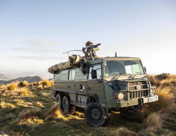 Soldiers on a pinzgauer vehicle during an exercise.