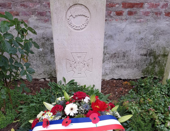 SGT Nicholas’ grave in Vertigneul Churchyard, near Romeries France with a wreath next to it.
