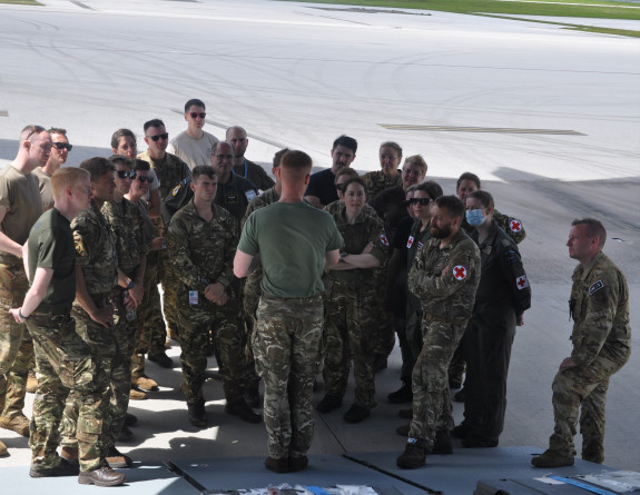 The NZDF Aeromedical Evacuation team congregate on the tarmac at the rear of a RAF aircraft during Exercise Mobility Guardian.