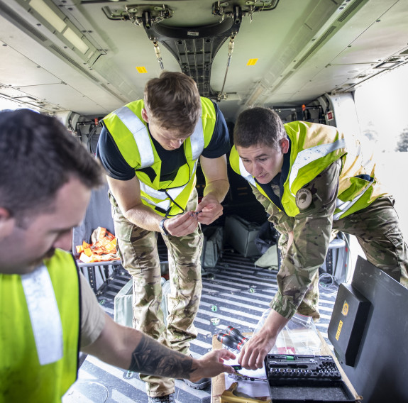 Corporal Rory McLachlan (right) with fellow RNZAF maintainers.