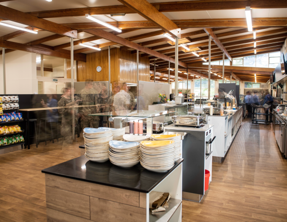 Persons move through Aylesbury Court, the self-service dining establishment in Burnham Camp.