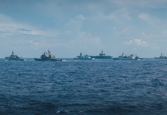A view from HMNZS Te Kaha as it exercises alongside ships from partner navies in the Philippines Sea