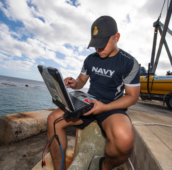 AHSO Nicoli Demafilez conducting survey work on the waterfront.