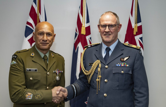 Chief of Defence Force, Air Marshal Kevin Short, presents a Defence Meritorious Service Medal to Warrant Officer Class One Te Aranga Pitiera Matthews