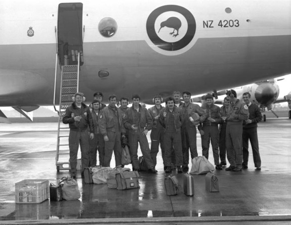 A black and white historical image of airmen standing outside an aircraft at Royal New Zealand Air Force Base Auckland