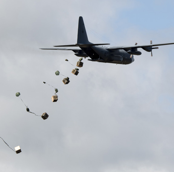 A C-130 Hercules aircraft carries out a load drop during an exercise